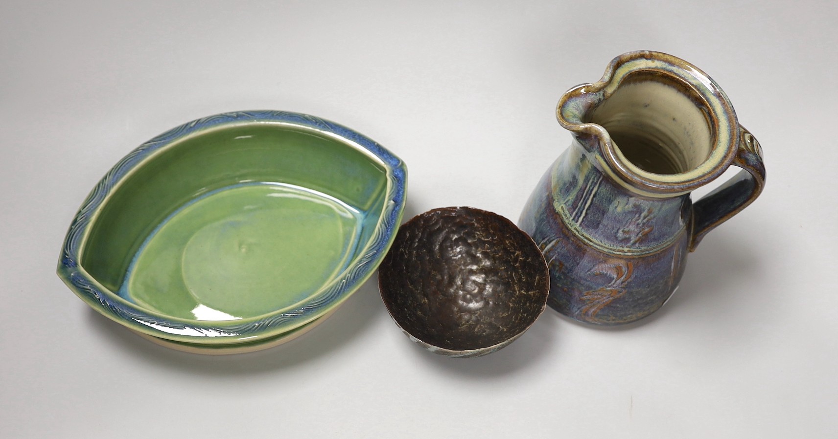 A Joe Finch (British b.1947) lustre jug, together with an Arwyn Jones eye shaped dish, and a Marcus Finch Raku bowl, tallest 16.5cm (3)